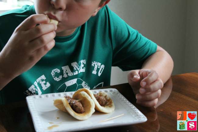 Eating pancake pigs in a blanket