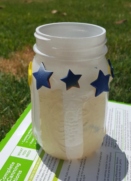 Mason jars with American Flag sprayed paint on it