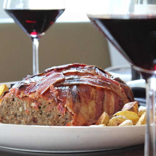 Bacon Wrapped Meatloaf Served With Wine