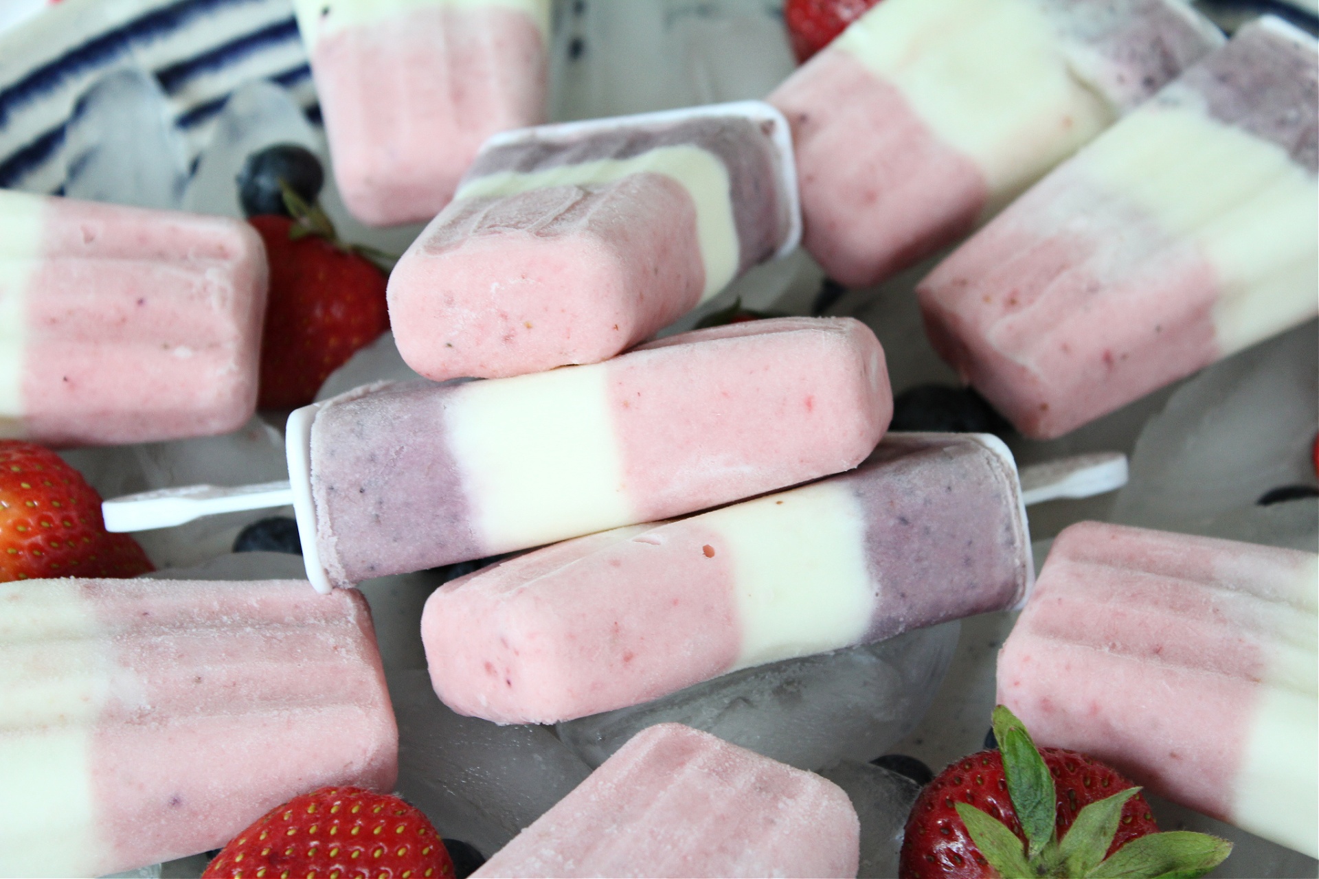 Red White and Blue Popsicles made with fruit and yogurt