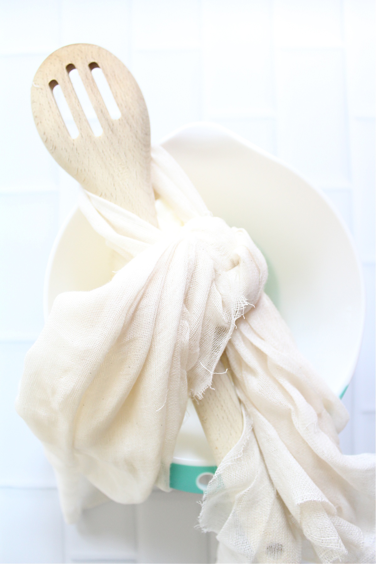 making labneh with cheesecloth