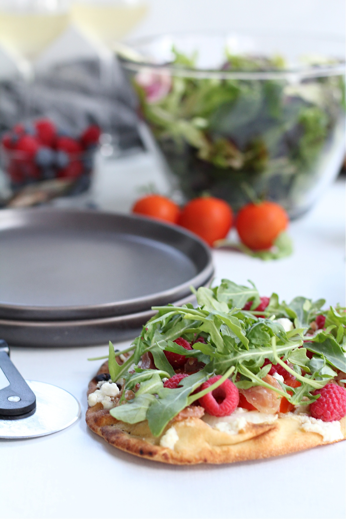 Tasty Raspberry and Prosciutto Pizza with Arugula and Goat Cheese