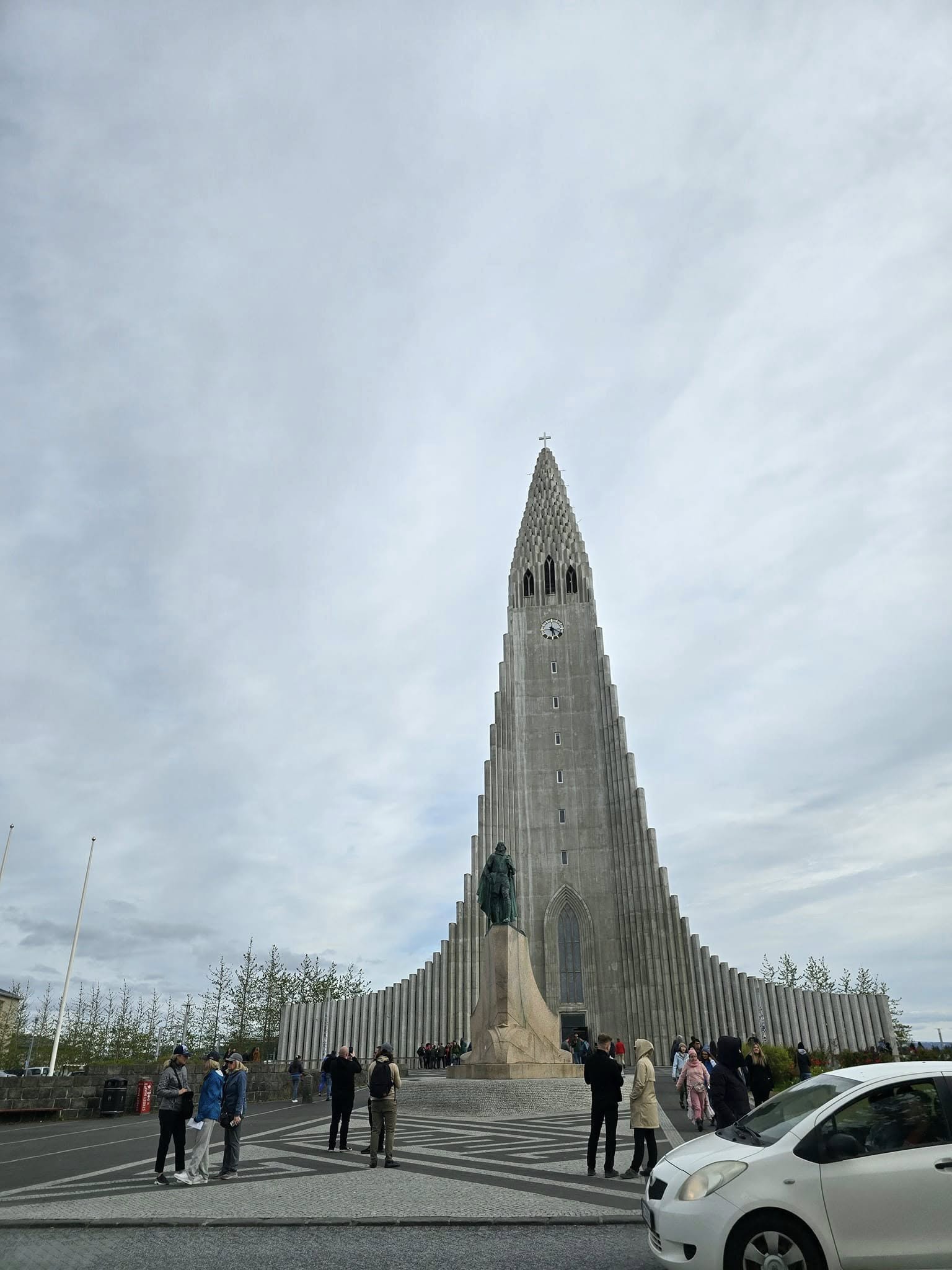 Hallgrimskirkja Church in Reykjavik, Iceland, towering over the city with mountains in the background. Hallgrimskirkja Church in Reykjavik, Iceland, towering over the city with mountains in the background.