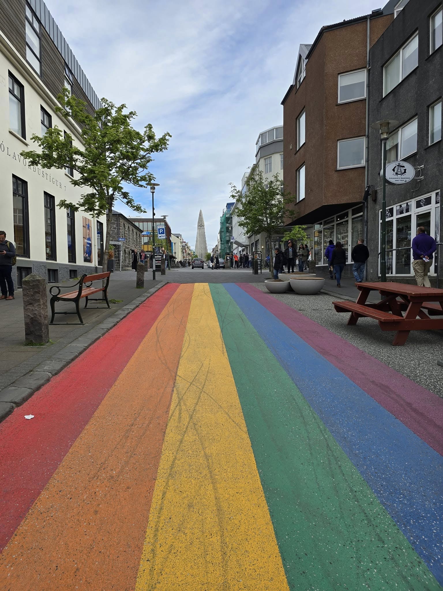 Colorful rainbow-painted Skólavörðustígur street in Reykjavik, Iceland, lined with shops and cafes. Colorful rainbow-painted Skólavörðustígur street in Reykjavik, Iceland, lined with shops and cafes.