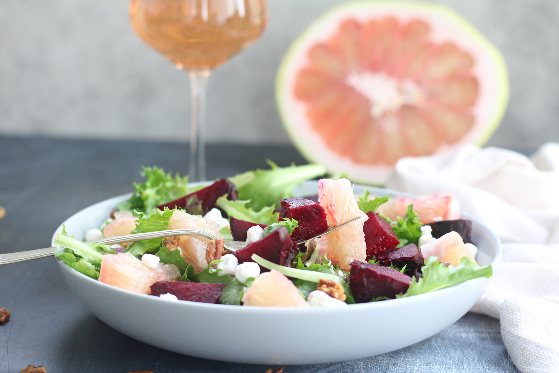 Fresh Florida Starburst Pummelo salad with roasted beets, greens, and creamy goat cheese