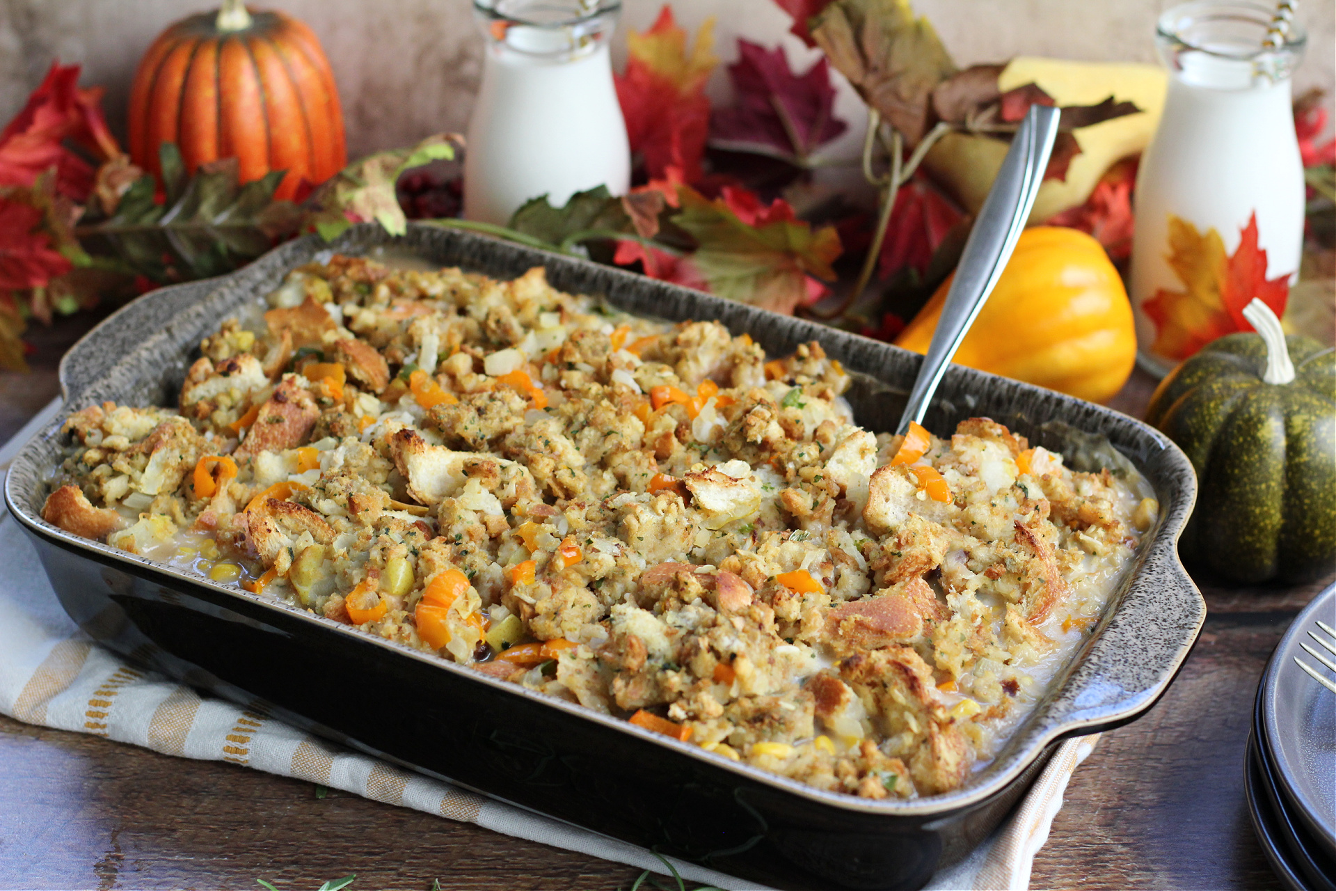 Thanksgiving Leftover Casserole served in a casserole dish made with turkey, stuffing, mashed potatoes, corn, and green beans.