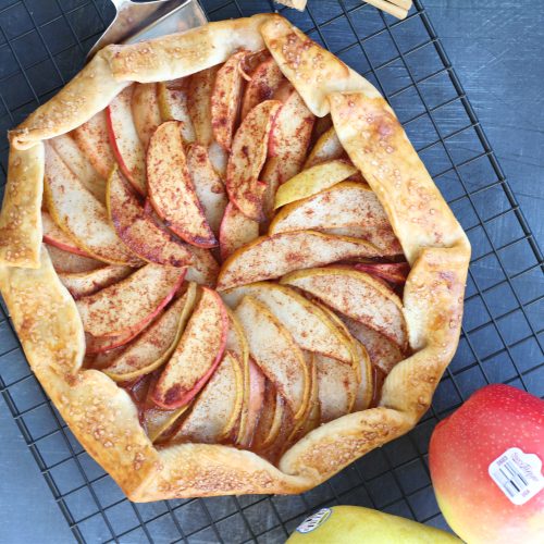 Top-down view of apple and pear galette with autumn colors and crispy edges.