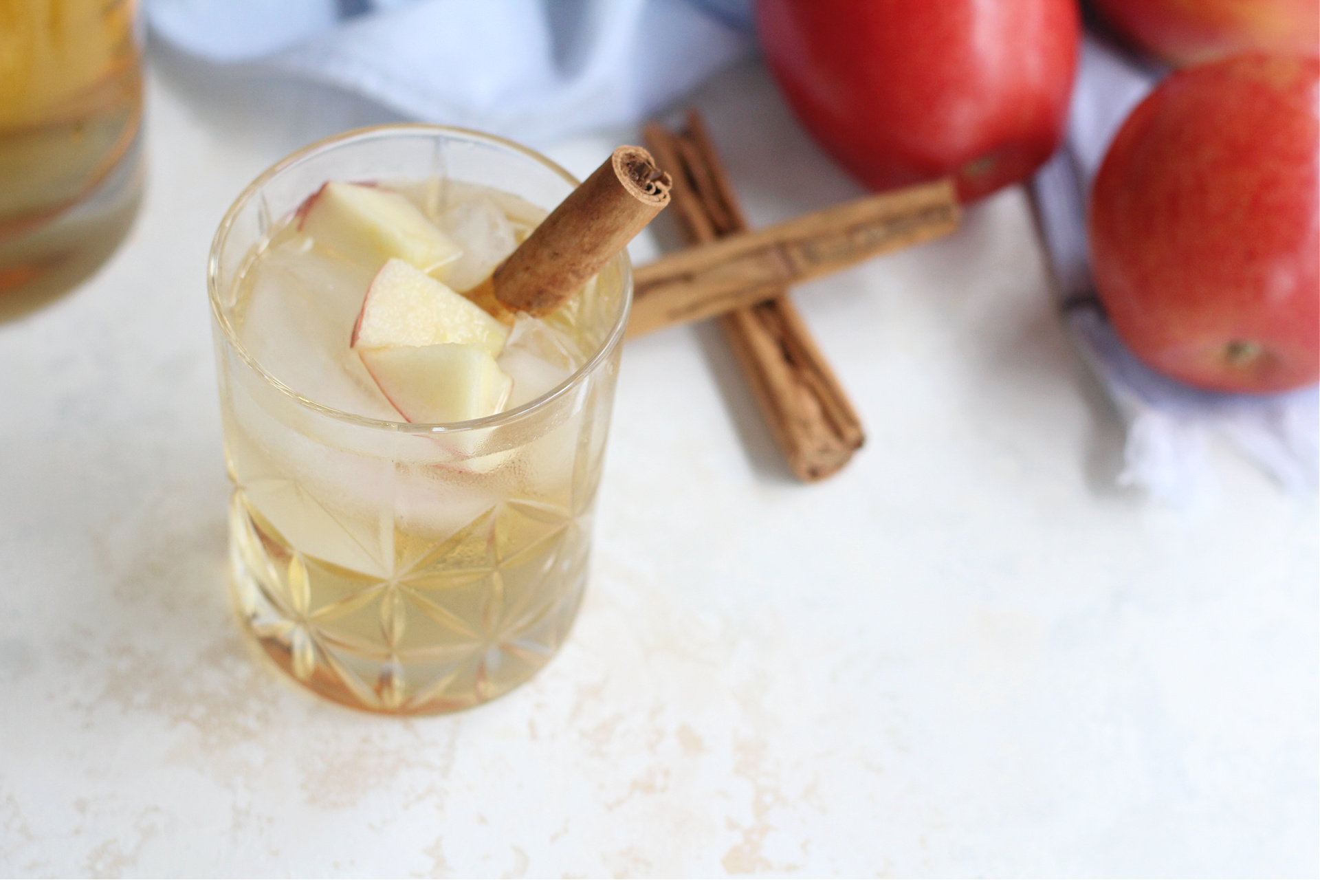 Refreshing apple sangria with diced apples in a glass.