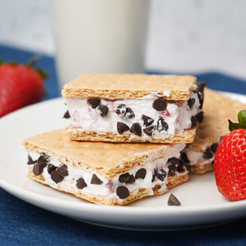 Close-up of strawberry chocolate chip ice cream sandwiches made with graham crackers.