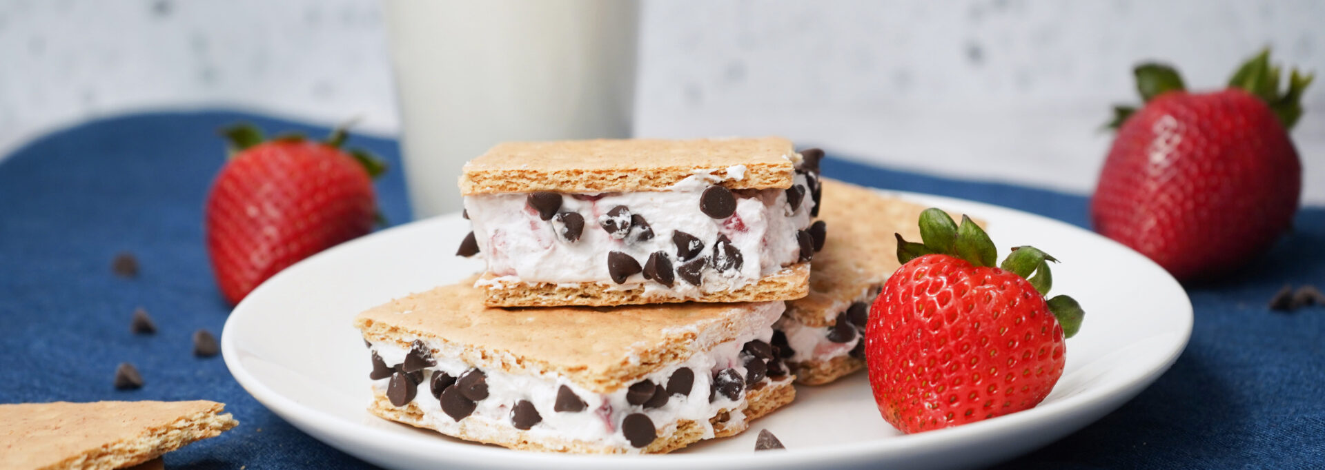 Graham cracker ice cream sandwiches filled with strawberry Cool Whip and mini chocolate chips.