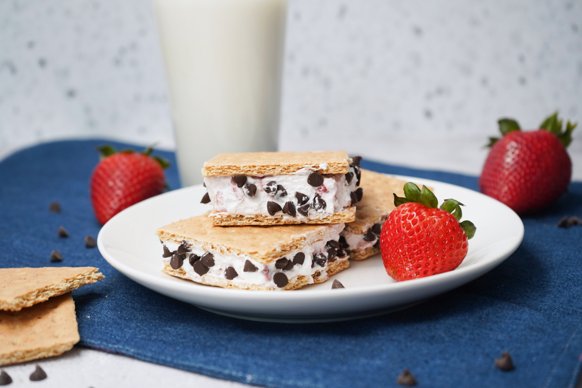 Graham cracker ice cream sandwiches filled with strawberry Cool Whip and mini chocolate chips.