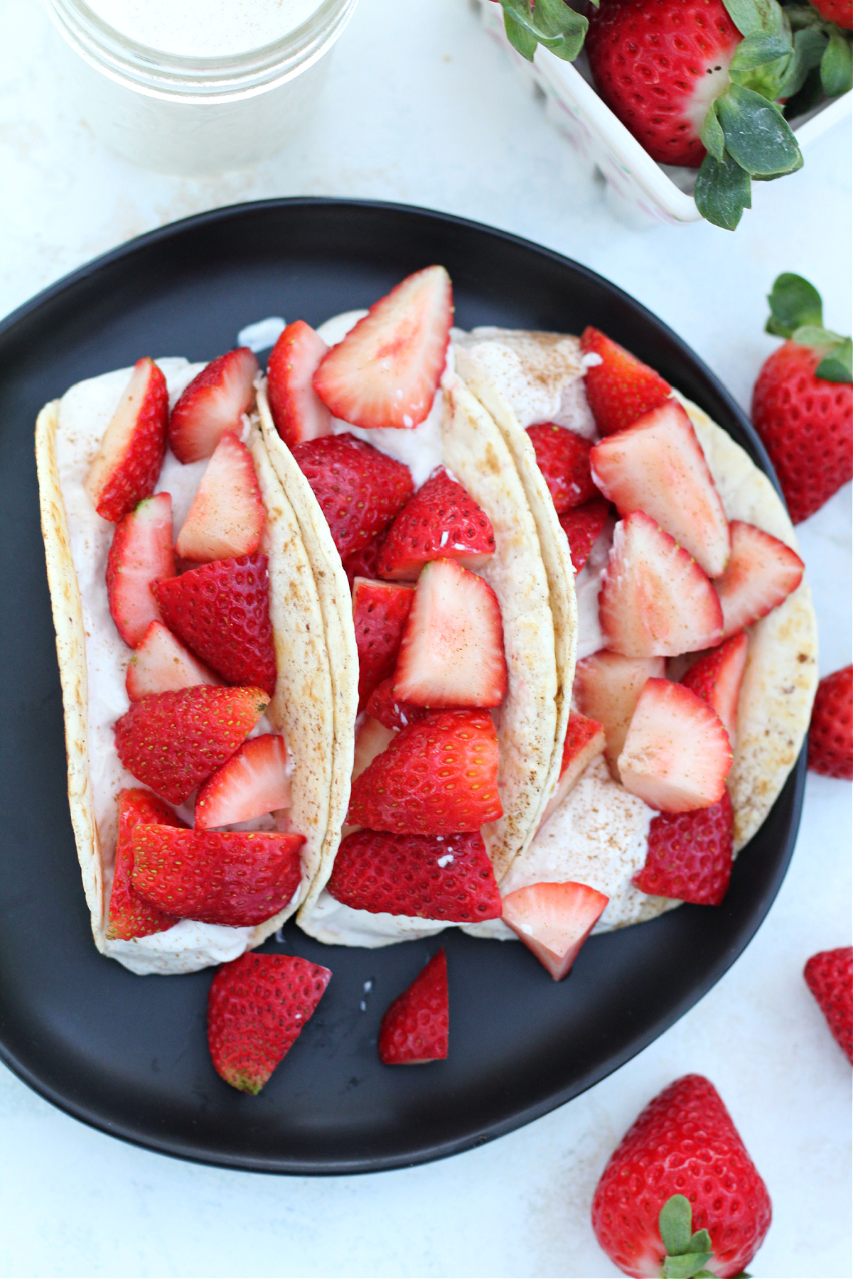 Strawberry dessert tacos styled for breakfast or brunch