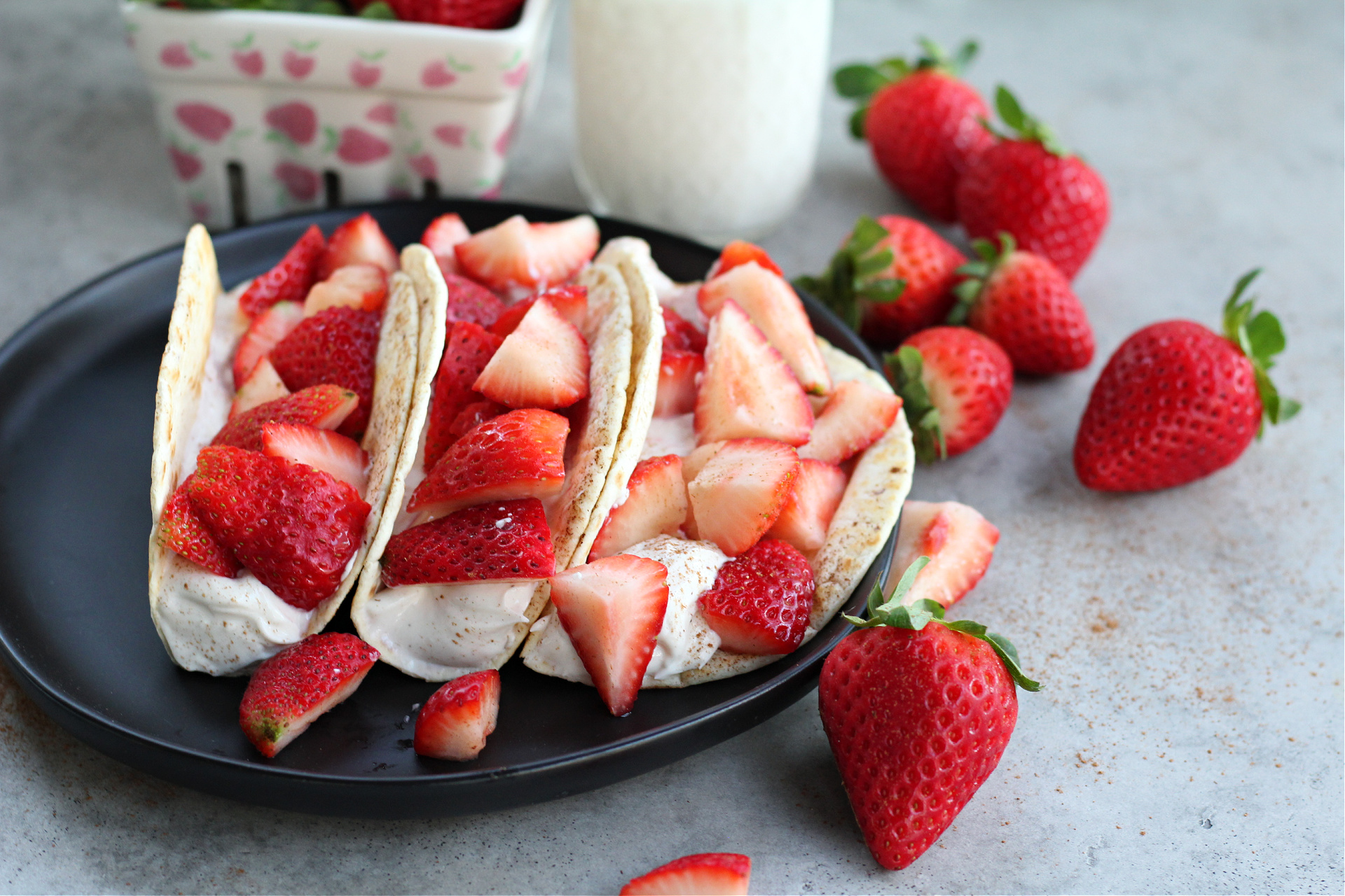 Light and healthy strawberry cheesecake tacos with fresh fruit
