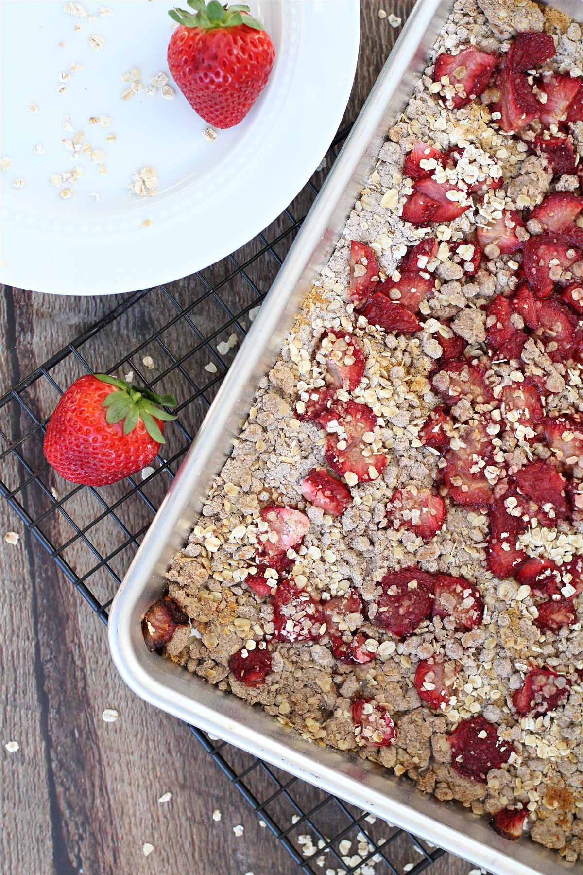 Strawberry oatmeal breakfast bars served with fresh strawberries
