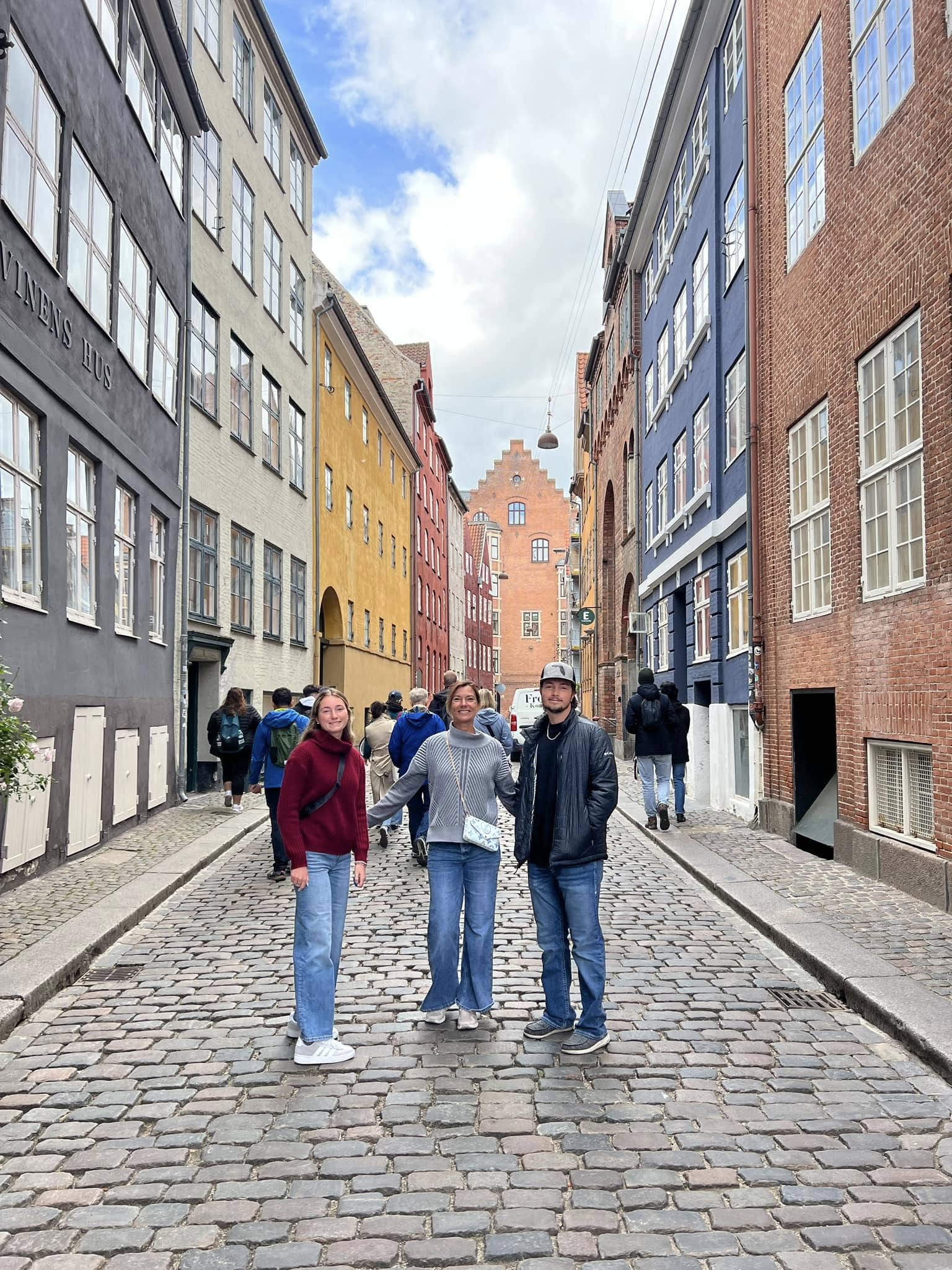Guided walking tour group exploring historic Copenhagen streets