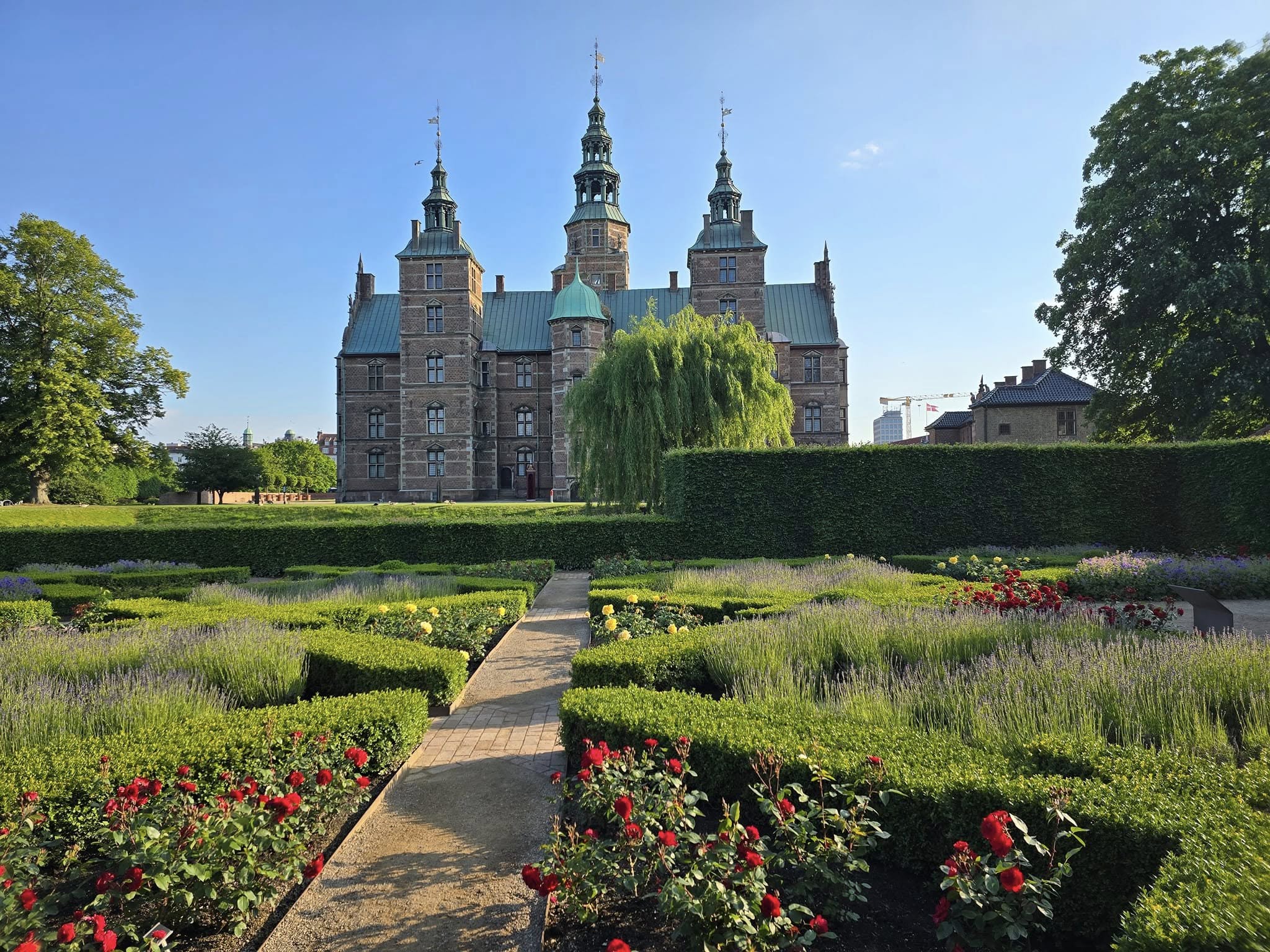 Cycling past Christiansborg Palace during a Copenhagen bike tour