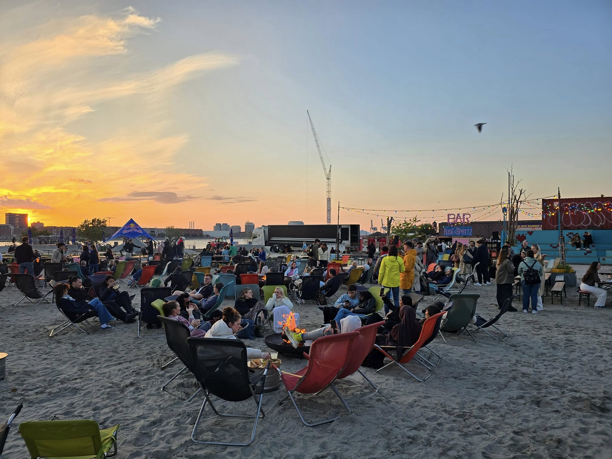 Outdoor seating at Reffen food market in Copenhagen at sunset