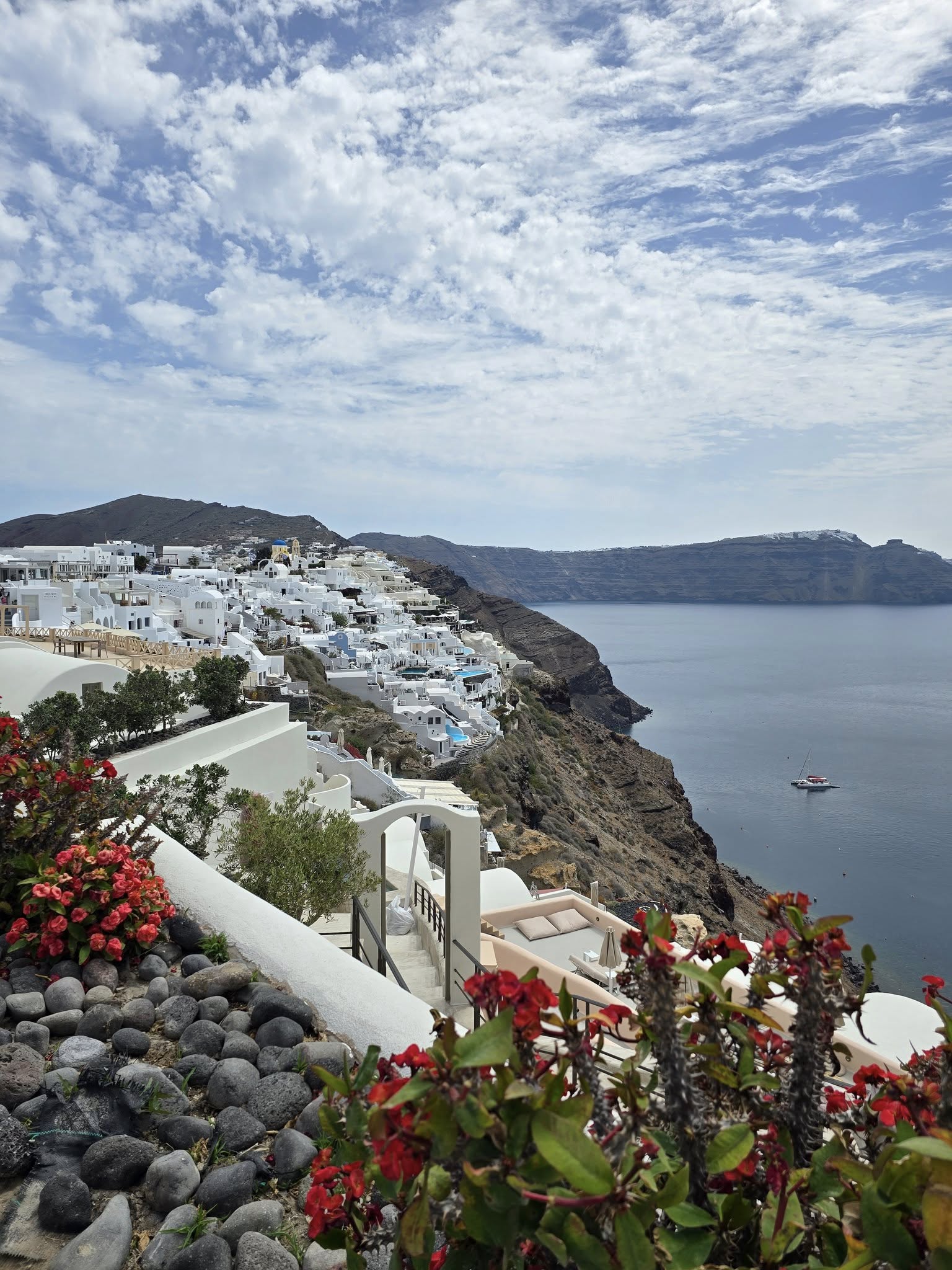 Blue domed churches and white buildings in Santorini Greece