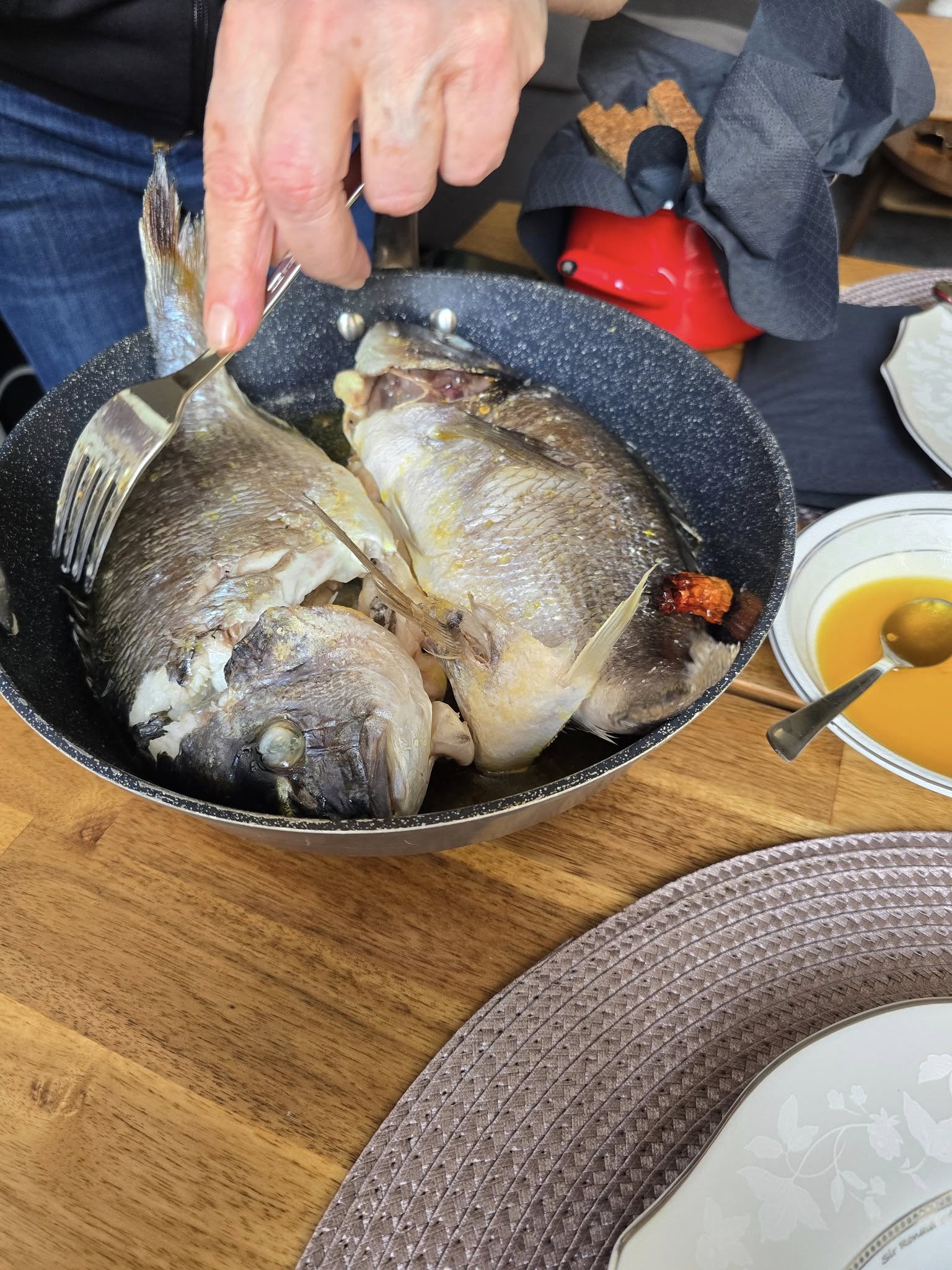 Greek cooking class in Athens preparing fresh seafood