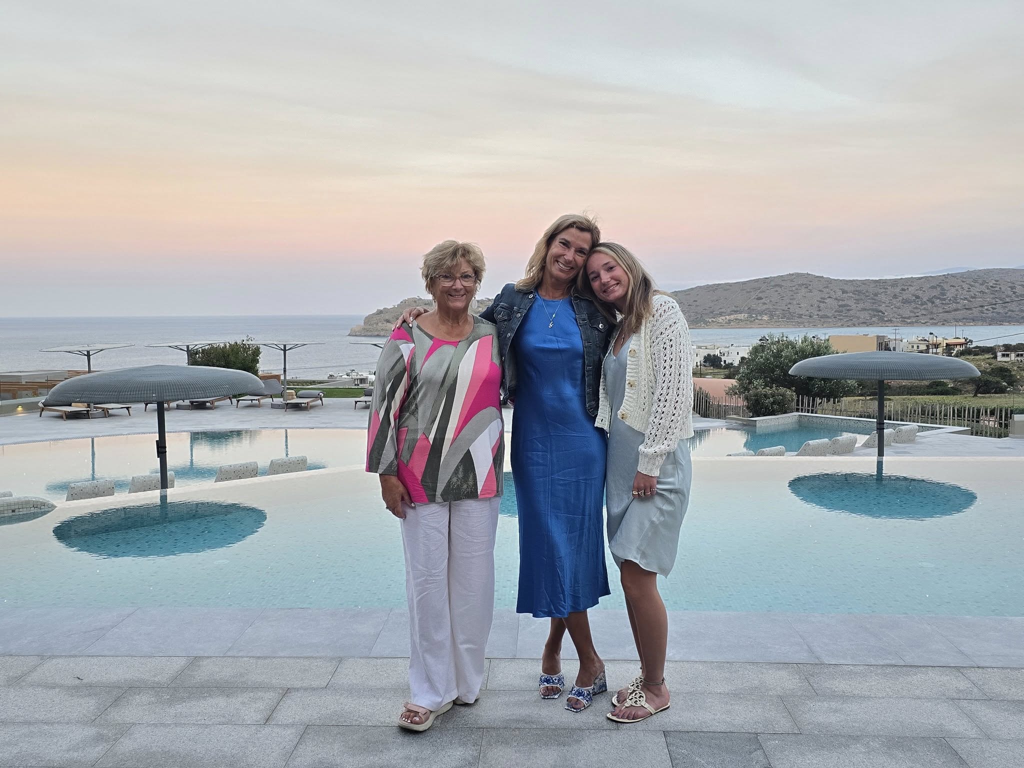 Women visiting Cayo Resort at sunset