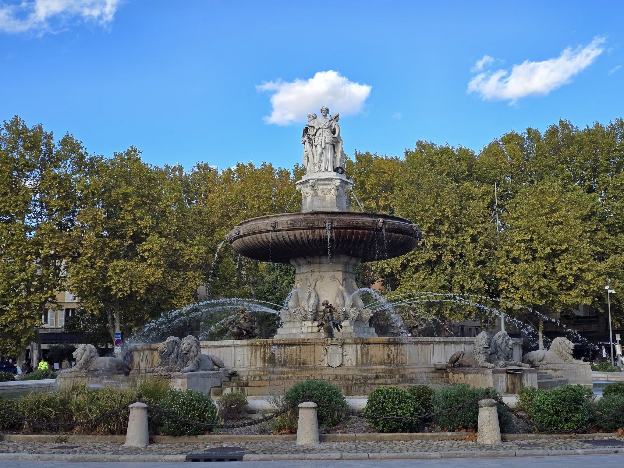 Aix-en-Provence tree-lined street with caf&eacute;s and fountains