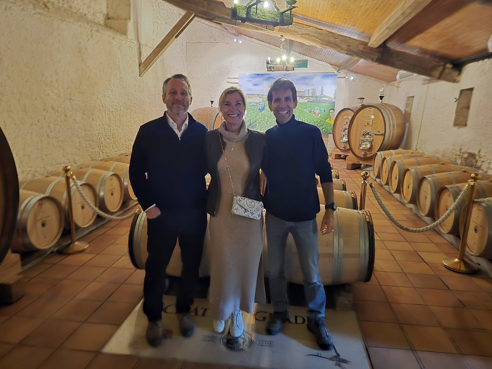Ch&acirc;teau Guadet wine cellar with barrels in Saint-&Eacute;milion
