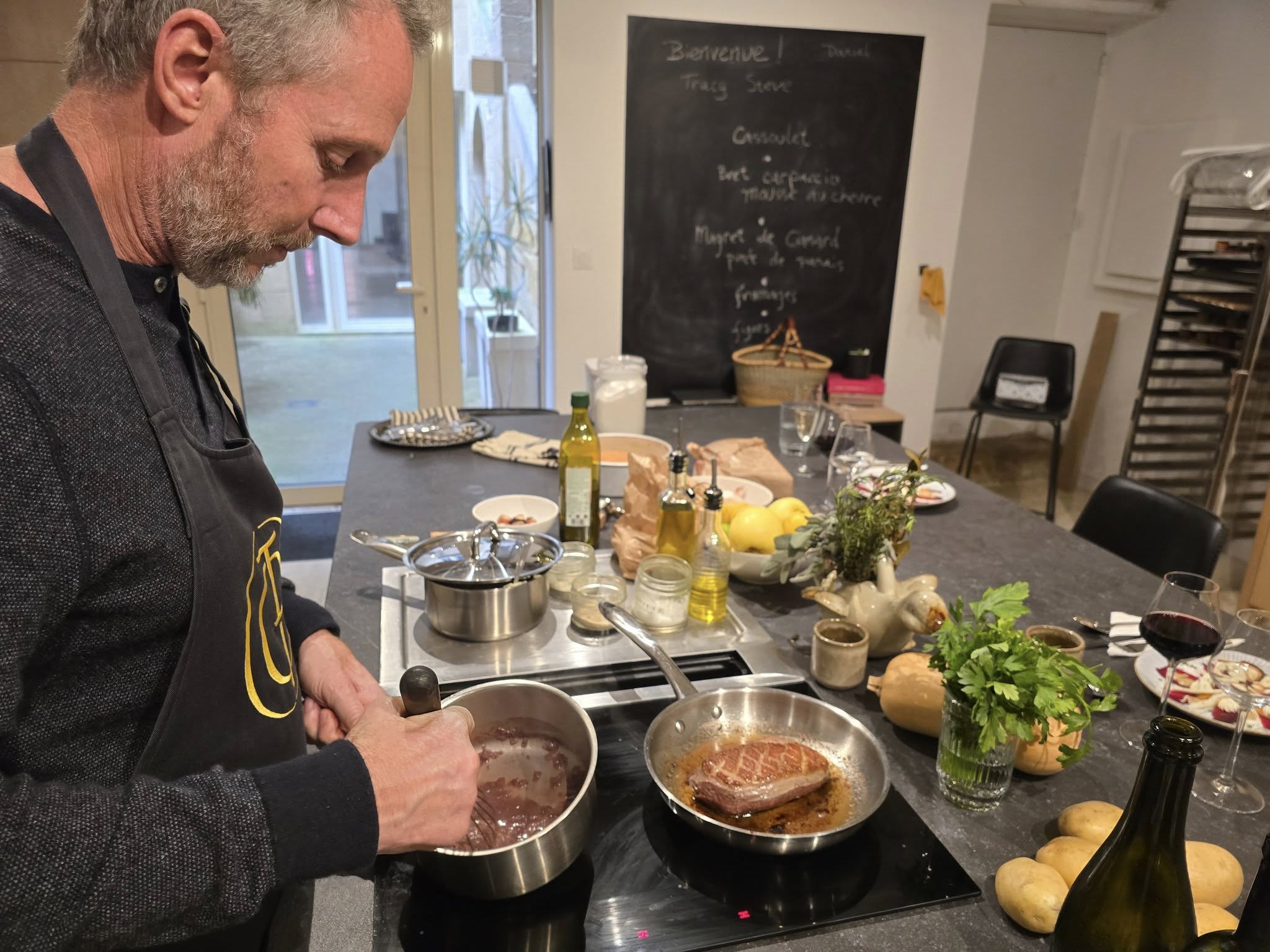 Making cassoulet traditional French dish made with duck and beans