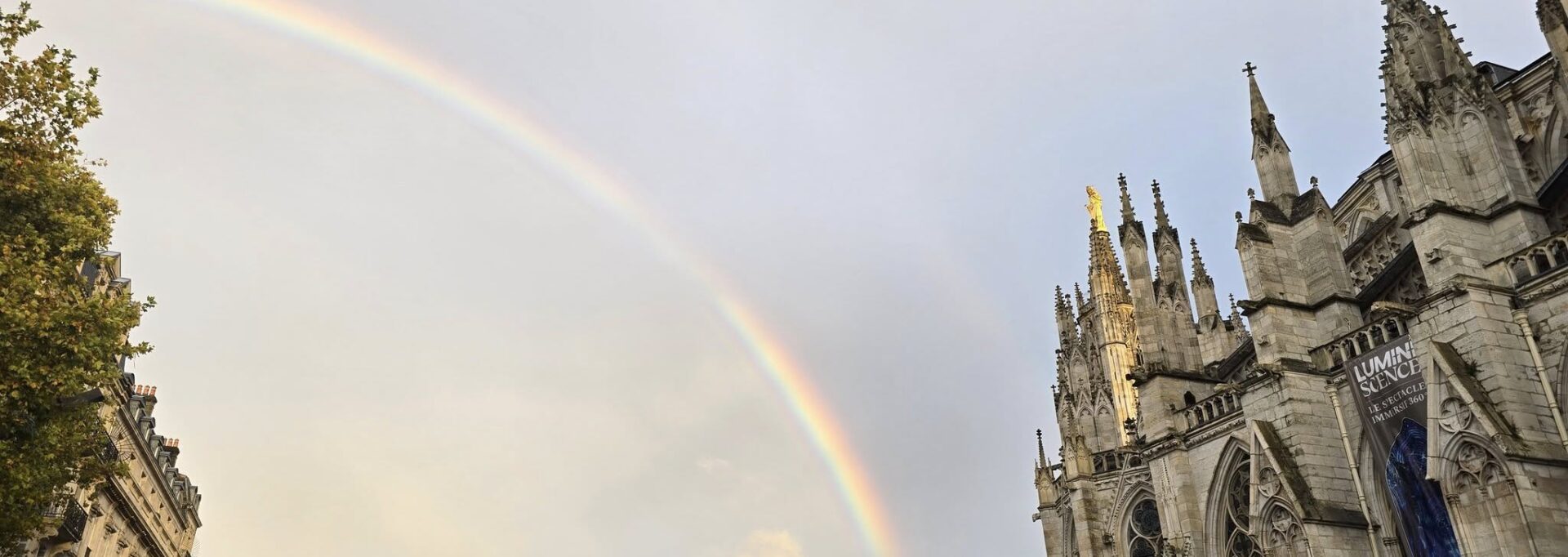 Rainbow over historic buildings in Bordeaux