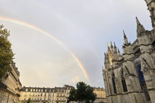Rainbow over historic buildings in Bordeaux