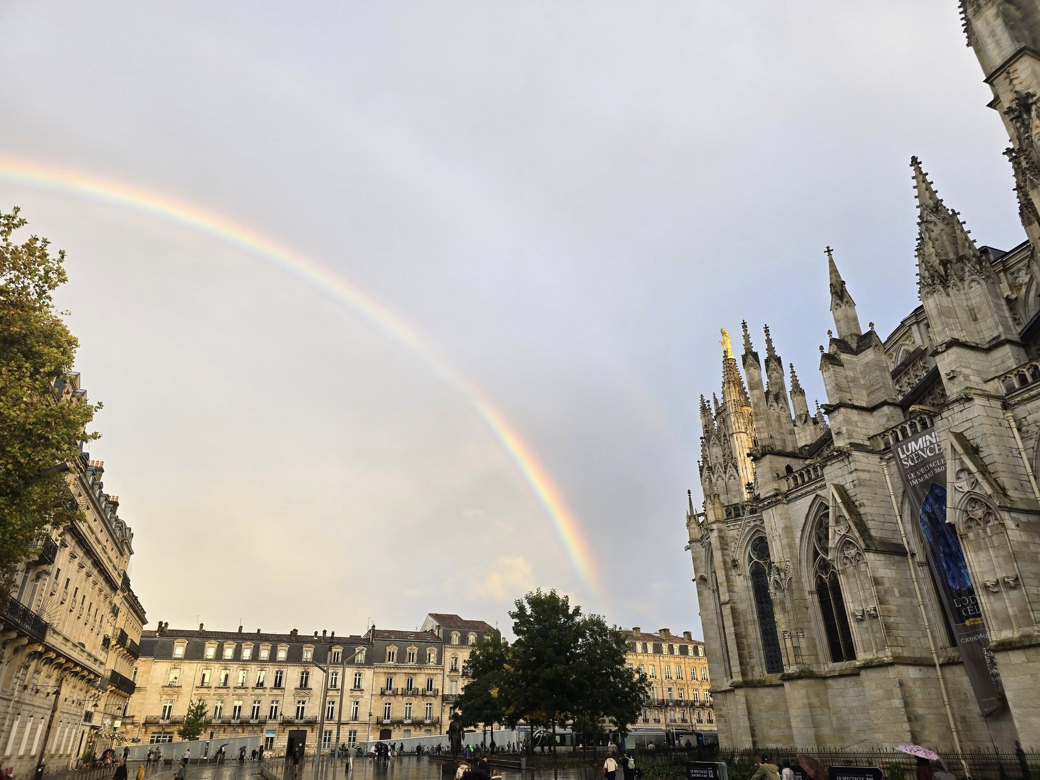 Rainbow over historic buildings in Bordeaux