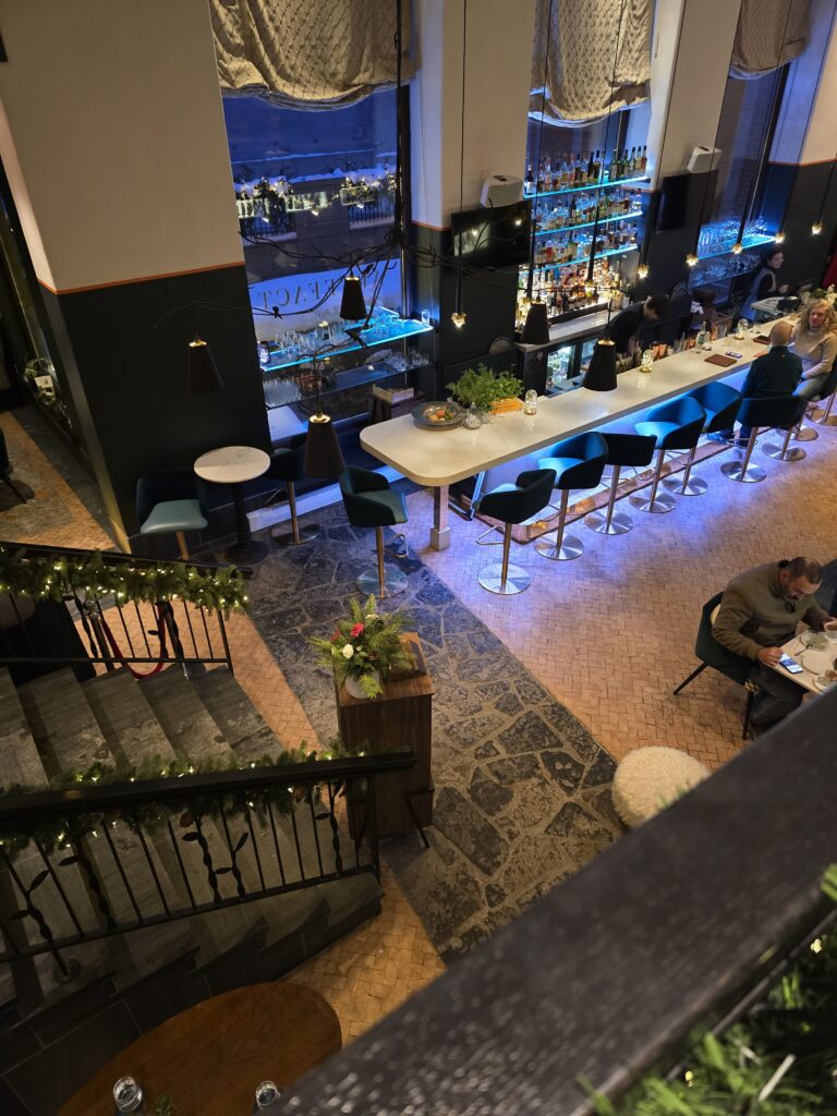 Looking down into the Artefact Bar within Auberge Saint-Antoine