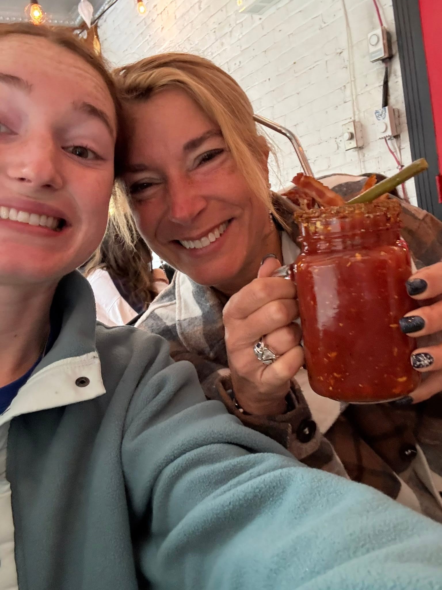 Mother and daughter trying a traditional Bloody Mary cocktail in Quebec City