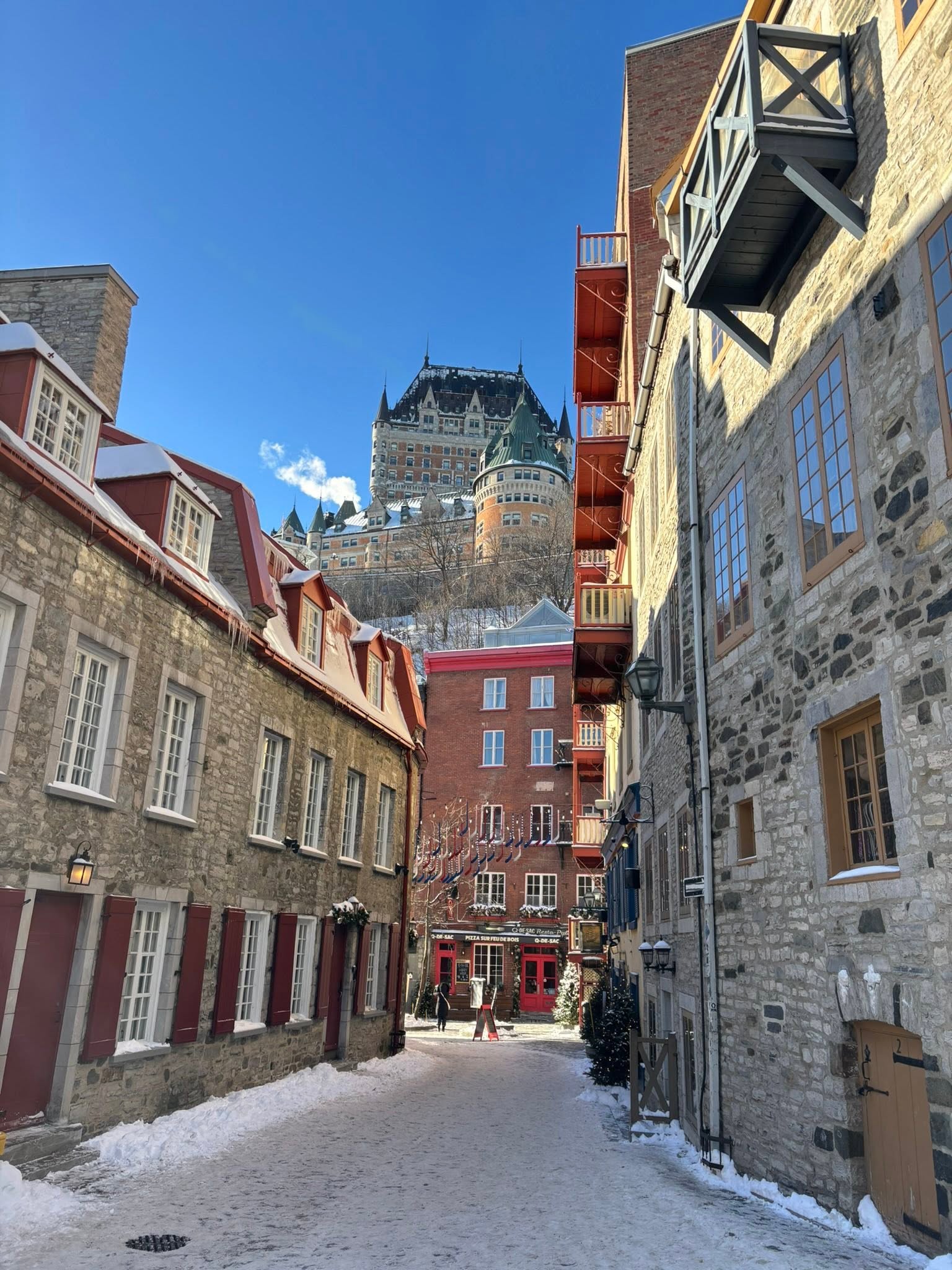 Walking tour through snowy cobblestone streets in Old Quebec