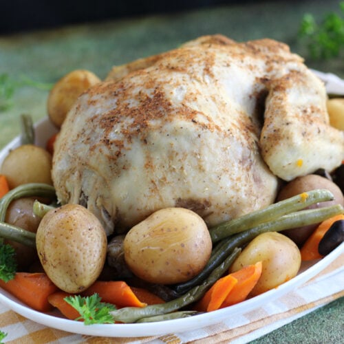 Easy slow cooker chicken pot roast with carrots, potatoes, and green beans