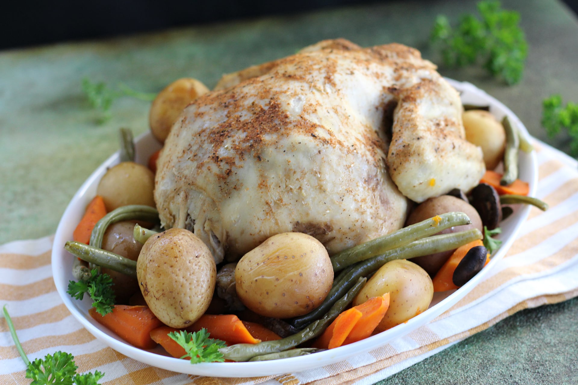 Easy slow cooker chicken pot roast with carrots, potatoes, and green beans