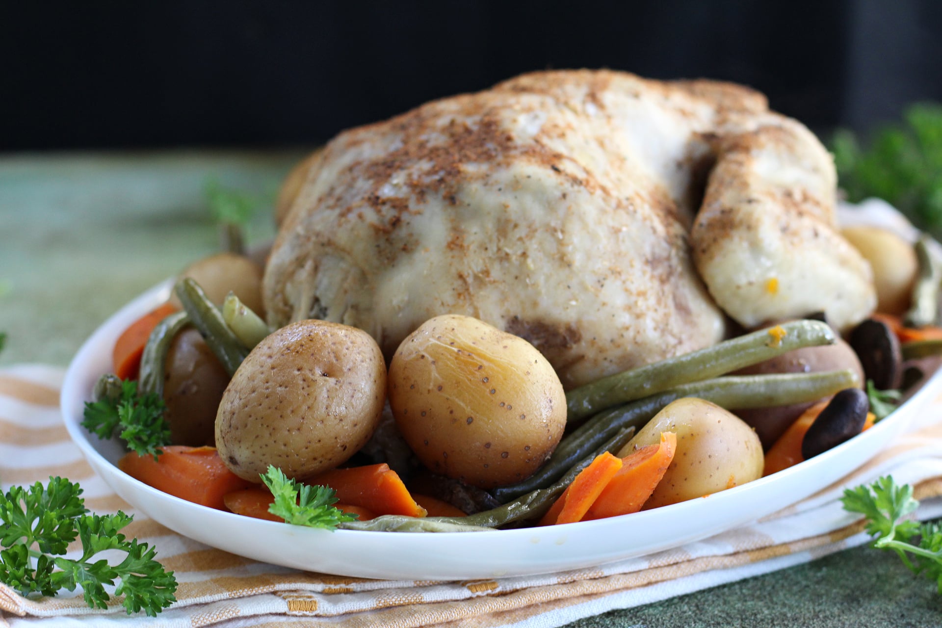 Easy slow cooker chicken dinner made with fresh vegetables and savory seasonings